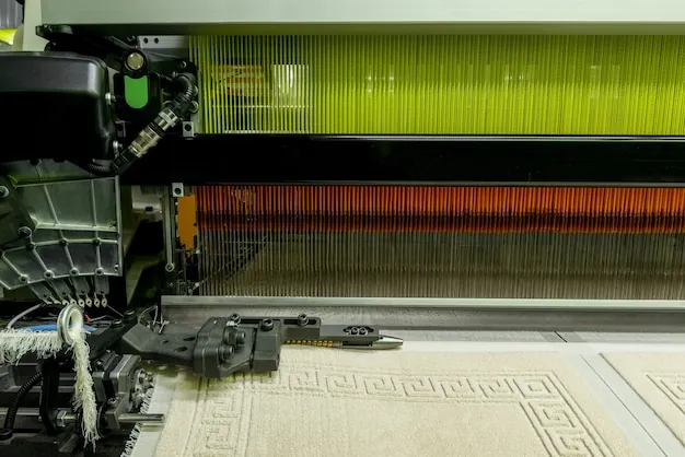 Close view of warp threads and woven terry on a loom